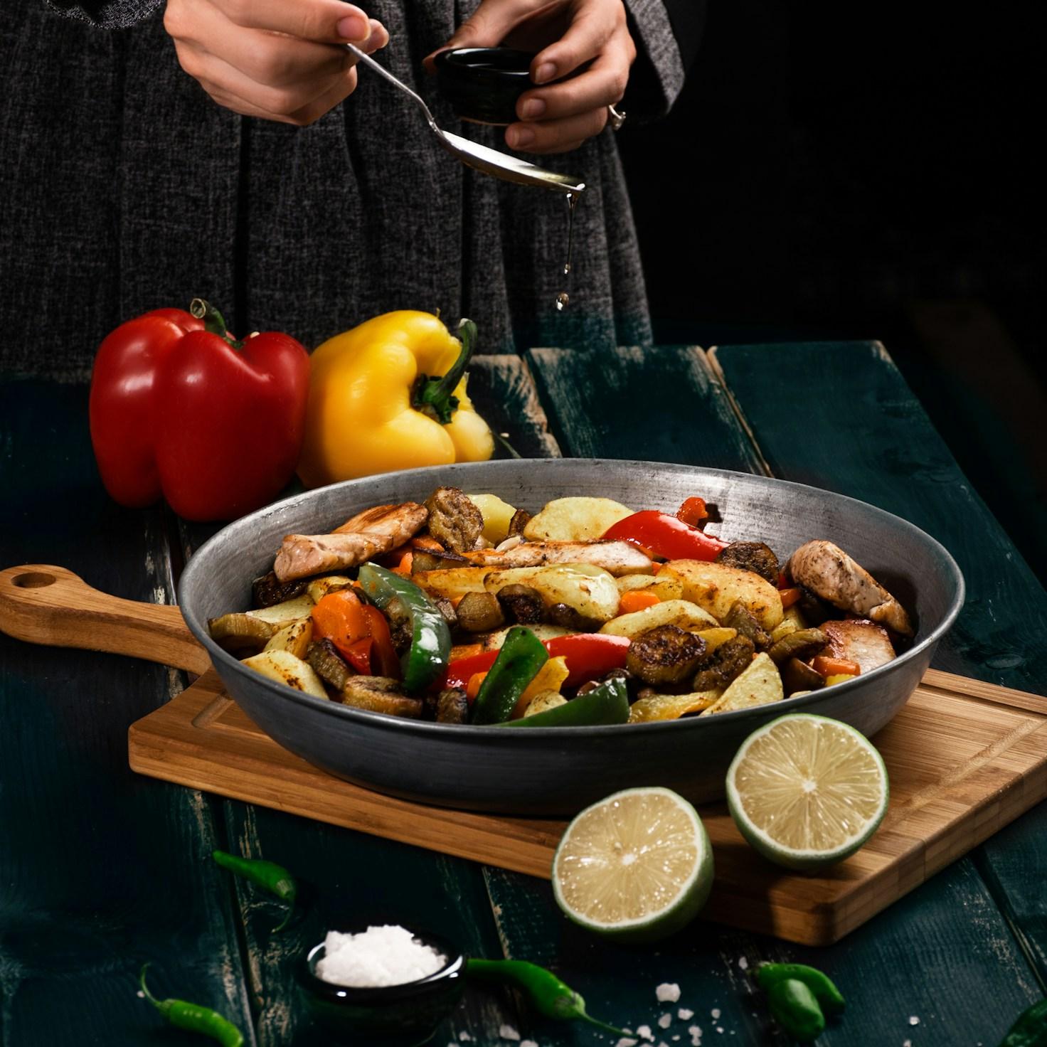 Community members collaborating in a modern kitchen space, sharing recipes and cooking techniques